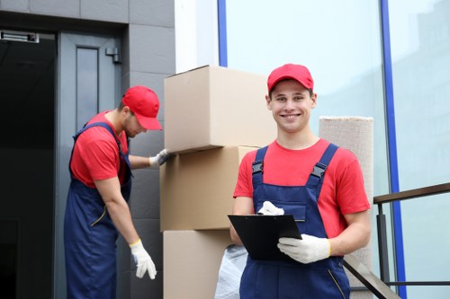 Office movers loading items for transport in North London
