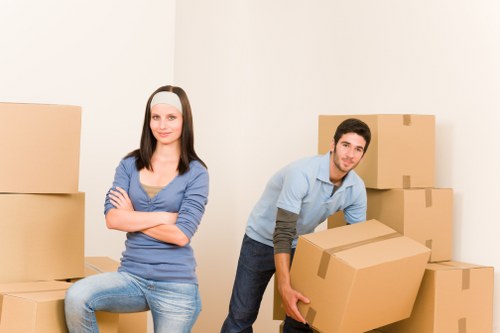 Loading furniture into a moving truck in a North London residential street