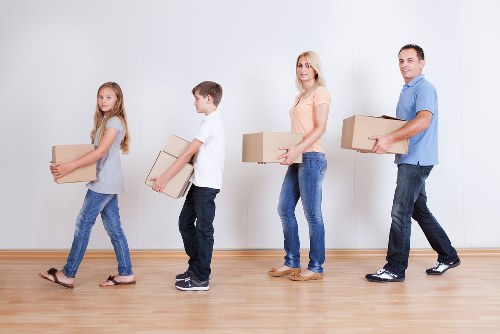 Packed boxes and furniture ready for a house removal service